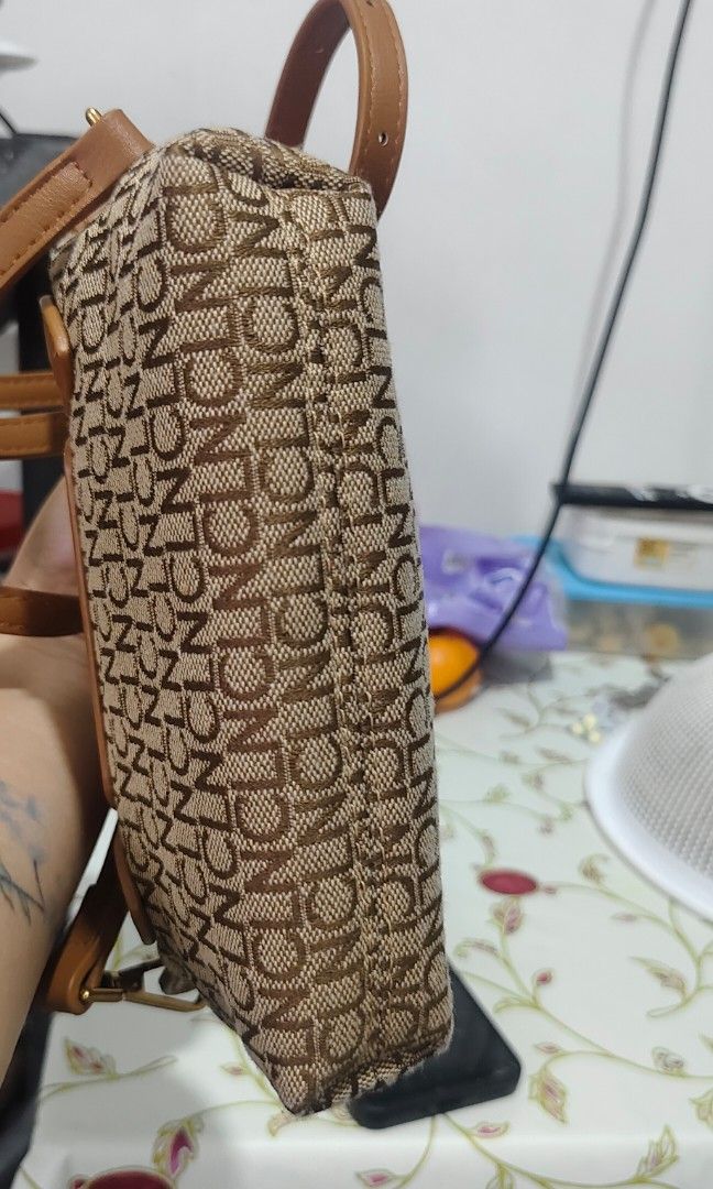 CLN Monogram Tia Mini Bag (Category: Luxury Bags & Wallets) located in Manila. Submitted by koko723 (Listing ID 1458337287, Image 2). Description: Selling my CLN Tia Mini Bag 😍 1000 only Perfect for daily use/OOTD CLN Phils authentic Color: Tan/Brown Monogram Size: Kasya small wallet and phone Condition: 9/10 Issue: Nalagyan ng lipstick yung loob pero konte lang .