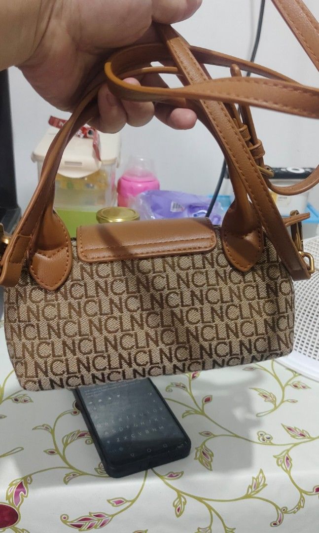 CLN Monogram Tia Mini Bag (Category: Luxury Bags & Wallets) located in Manila. Submitted by koko723 (Listing ID 1458337287, Image 3). Description: Selling my CLN Tia Mini Bag 😍 1000 only Perfect for daily use/OOTD CLN Phils authentic Color: Tan/Brown Monogram Size: Kasya small wallet and phone Condition: 9/10 Issue: Nalagyan ng lipstick yung loob pero konte lang .