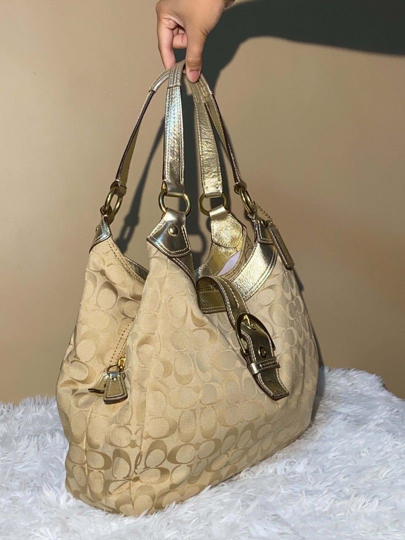 Coach Monogram Hobo Bag Gold Accents (Category: Luxury Bags & Wallets) located in Bulacan. Submitted by bella.ken.varietystore (Listing ID 1458338172, Image 3). Description: Classic Coach hobo bag in tan monogram canvas with gold leather trim. Features multiple interior compartments and a zip pocket. Perfect for everyday use..