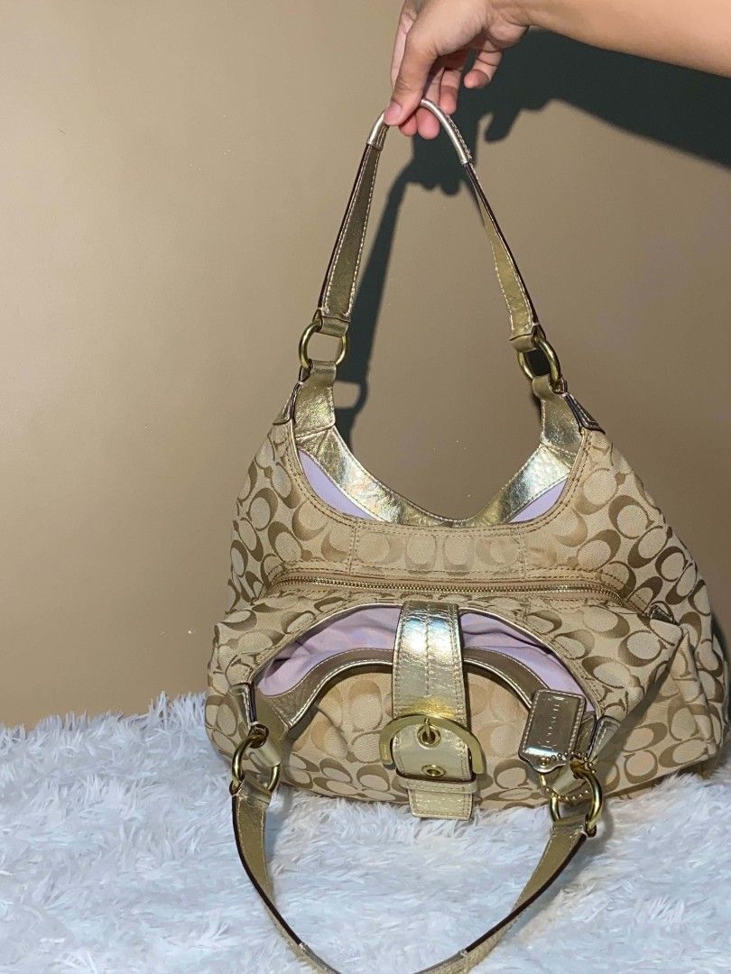 Coach Monogram Hobo Bag Gold Accents (Category: Luxury Bags & Wallets) located in Bulacan. Submitted by bella.ken.varietystore (Listing ID 1458338172, Image 2). Description: Classic Coach hobo bag in tan monogram canvas with gold leather trim. Features multiple interior compartments and a zip pocket. Perfect for everyday use..