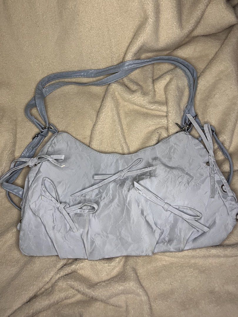 Coquette Blue Fairy Sling/Backpack Bag (Category: Shoulder Bags) located in Tanauan. Submitted by leighshin (Listing ID 1458432489, Image 1). Description: Brand new Ribbon design Can use as shoulder bag and as backpack .