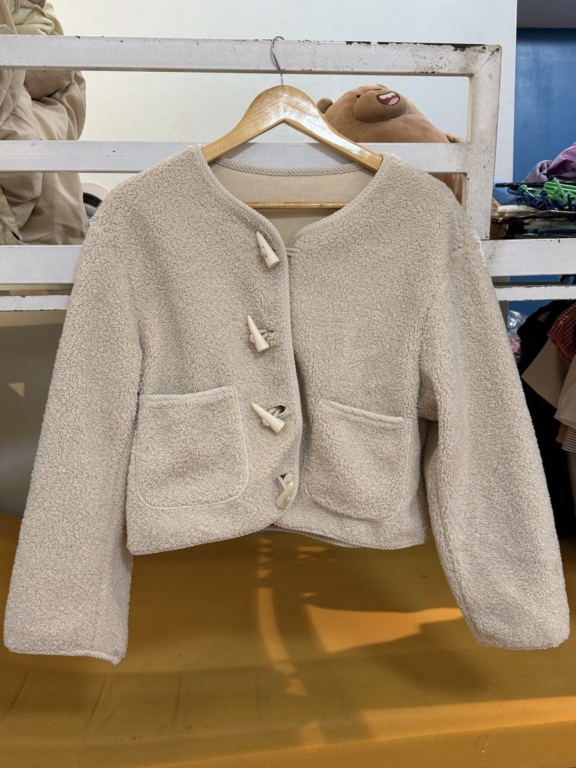 Cream Fleece Jacket with Toggle Buttons (Category: Coats, Jackets and Outerwear) located in Navotas City. Submitted by yangi_2 (Listing ID 1458387493, Image 1). Description: 🤍 Cream Fleece Jacket • Super cozy & soft cream fleece material • Cute toggle button closures • Two front pockets • Soft & smooth lining for added comfort • Perfect for layering on cooler days • Easy to style for a cozy, casual look • Best fit for M–L Preloved item and in go