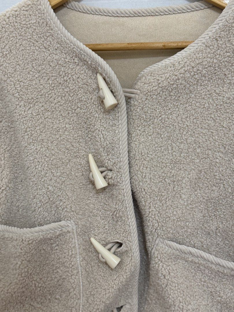Cream Fleece Jacket with Toggle Buttons (Category: Coats, Jackets and Outerwear) located in Navotas City. Submitted by yangi_2 (Listing ID 1458387493, Image 3). Description: 🤍 Cream Fleece Jacket • Super cozy & soft cream fleece material • Cute toggle button closures • Two front pockets • Soft & smooth lining for added comfort • Perfect for layering on cooler days • Easy to style for a cozy, casual look • Best fit for M–L Preloved item and in go