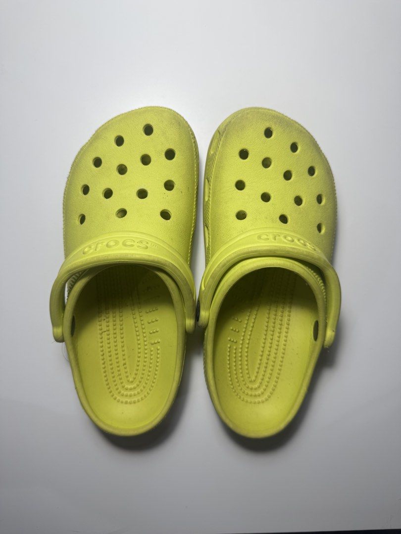 Crocs Classic Clogs - Citrus/Shrek (Category: Flats & Sandals) located in Makati City. Submitted by fifoaway (Listing ID 1458392745, Image 1). Description: - Classic yellow Crocs clogs - Easy slip-on design - Iconic style for everyday wear - Minor scuffs and dirt from normal use - Ready for a new owner - Mens: 5 | Womens: 7.