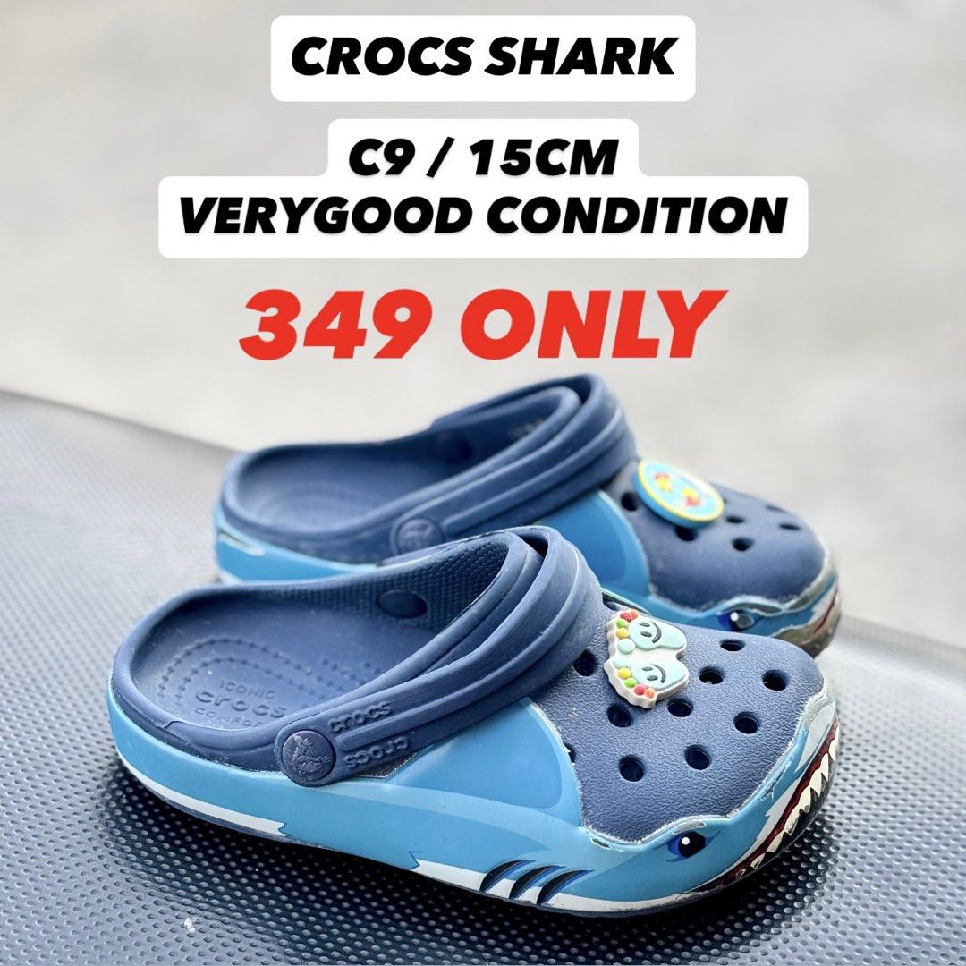 Crocs Shark Clogs Size C9 / 15cm (Category: Babies & Kids Fashion) located in San Fernando. Submitted by kickslocker (Listing ID 1458340226, Image 1). Description: - Blue Crocs clogs - Fun shark design - Size C9 (fits approx. 15cm) - Easy slip-on and off - Perfect for shark-loving kids!.