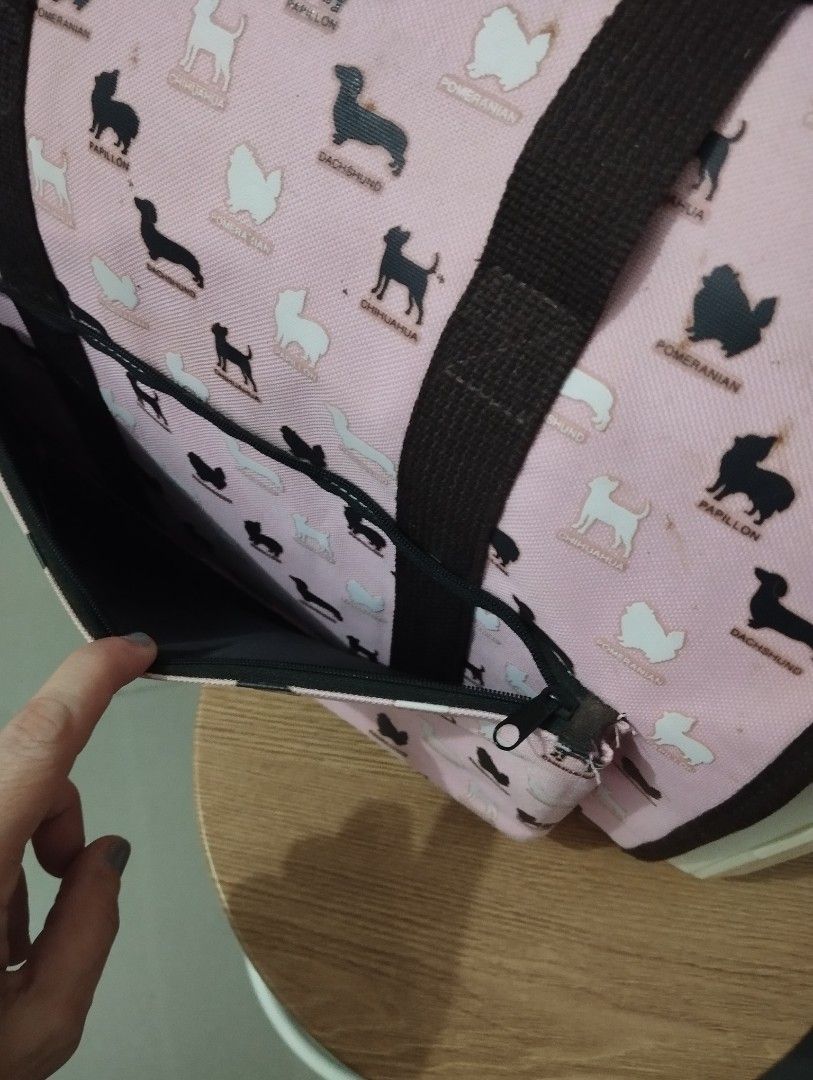 Cute Pink Dog Pattern Pet Carrier Bag with Hard Case (Category: Homes & Other Pet Accessories) located in Manila. Submitted by beckylafea (Listing ID 1458341912, Image 3). Description: - Fun pink pet carrier with an all-over dog pattern. - Sturdy hard plastic front with a secure latch for safety. - Convenient side pockets for storing essentials. - Comfortable handles for easy carrying. - Ideal for small pets. - Simple to clean interior. with seve