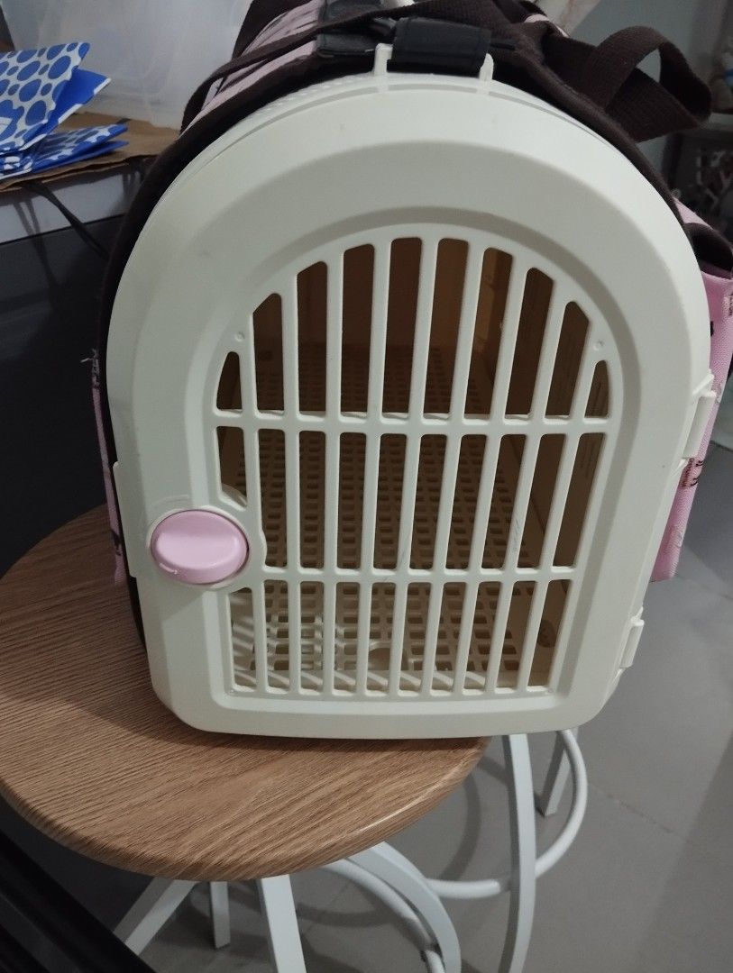 Cute Pink Dog Pattern Pet Carrier Bag with Hard Case (Category: Homes & Other Pet Accessories) located in Manila. Submitted by beckylafea (Listing ID 1458341912, Image 2). Description: - Fun pink pet carrier with an all-over dog pattern. - Sturdy hard plastic front with a secure latch for safety. - Convenient side pockets for storing essentials. - Comfortable handles for easy carrying. - Ideal for small pets. - Simple to clean interior. with seve