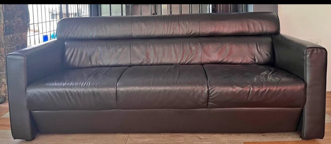 Dark Brown Leather 3-Seater Sofa (Category: Sofas) located in Manila. Submitted by otansebastian01 (Listing ID 1458412129, Image 1). Description: - Dark brown 3-seater leather sofa -180cm x 80cm - Comfortable cushions - Beautiful sheen on the leather - Modern and sleek design - Fits well in most living spaces - Ideal for lounging and entertaining - Ready for a new home check item near las pinas cityhall.