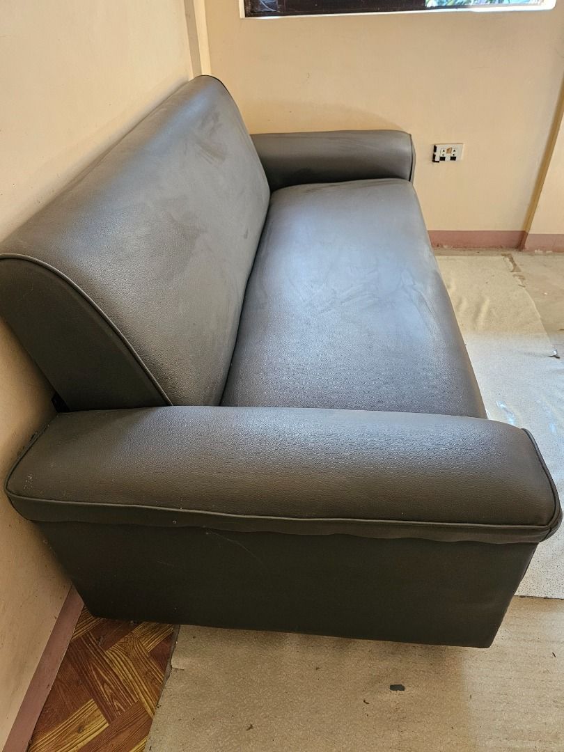 Dark Grey 3-Seater Sofa (Category: Sofas) located in Caloocan City. Submitted by freeshark.48ec8d (Listing ID 1458439877, Image 2). Description: - Dark grey 3-seater sofa - Modern design with sleek metal legs - Upholstery shows some signs of wear, with minor cracks on the seat cushion - Still functional and comfortable - Perfect for any living space -Width 79 inches.