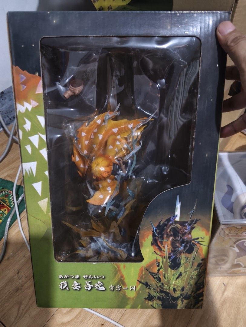 Demon Slayer Zenitsu Agatsuma Figure (Category: Figurines & Statues) located in Cainta. Submitted by xtiant (Listing ID 1458419977, Image 1). Description: - Demon Slayer: Kimetsu no Yaiba figure - Character: Zenitsu Agatsuma - Condition: BIB - Box condition: Minor wear - Features: Dynamic pose with lightning effects (eyes are lighting as well) - Ideal for: Any Demon Slayer fan.