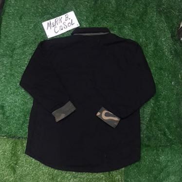 Dickies Black Quilted Lined Work Shirt Jacket (Category: Coats, Jackets and Outerwear) located in Taytay. Submitted by markcasol45 (Listing ID 1458371223, Image 3). Description: - Dickies black work shirt jacket - Quilted lining for extra warmth - Camo print on inside collar and cuffs - Button-up front with chest pockets - Durable material - Perfect for layering or wearing alone - Ready for its next owner.