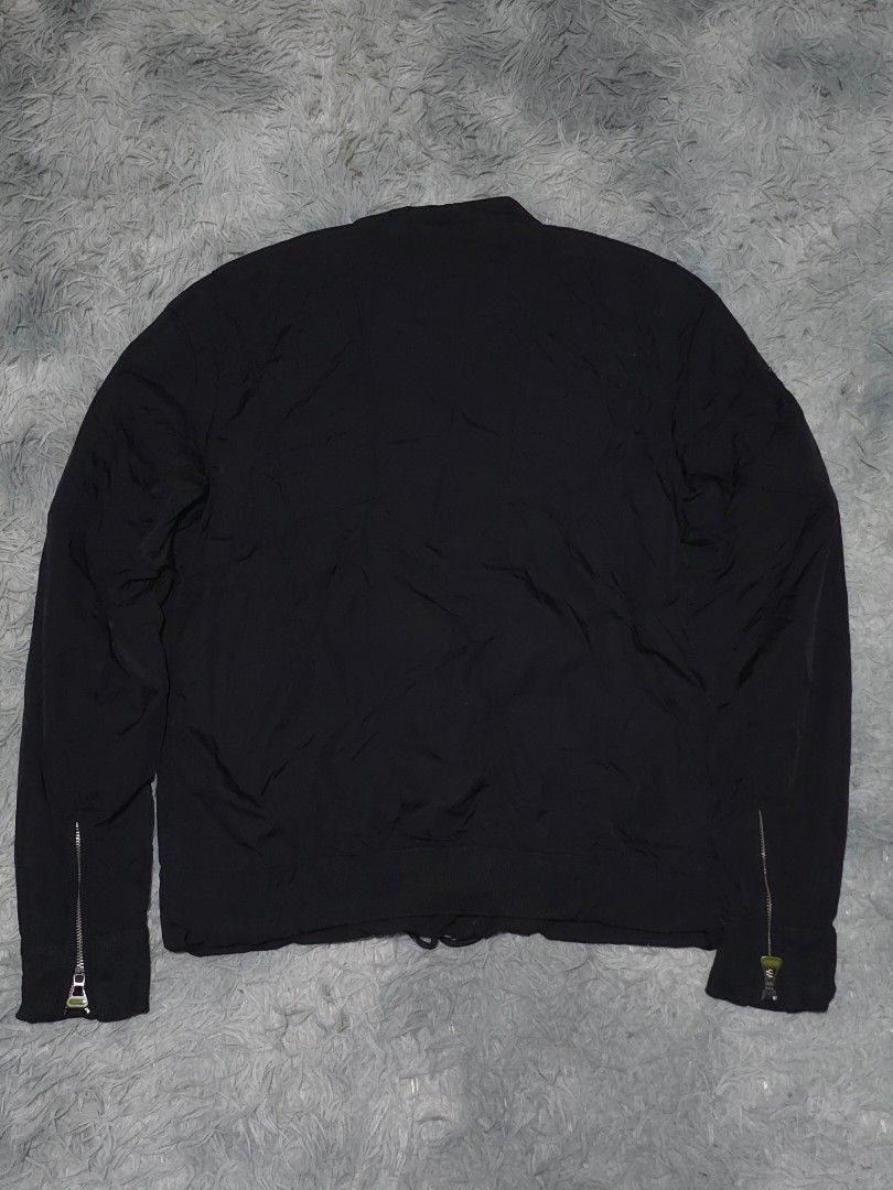 Diesel x Ducati Black Riding Jacket (Category: Coats, Jackets and Outerwear) located in Abulug. Submitted by humanwhosellthings (Listing ID 1458304735, Image 2). Description: - Authentic Diesel x Ducati Riding Jacket ✅️Medium 21W x 24.5L - Features Ducati logo on chest and sleeve - Full zipper closure - Zipper details on cuffs - Ideal for Ducati enthusiasts - Versatile for casual wear or motorcycle riding.