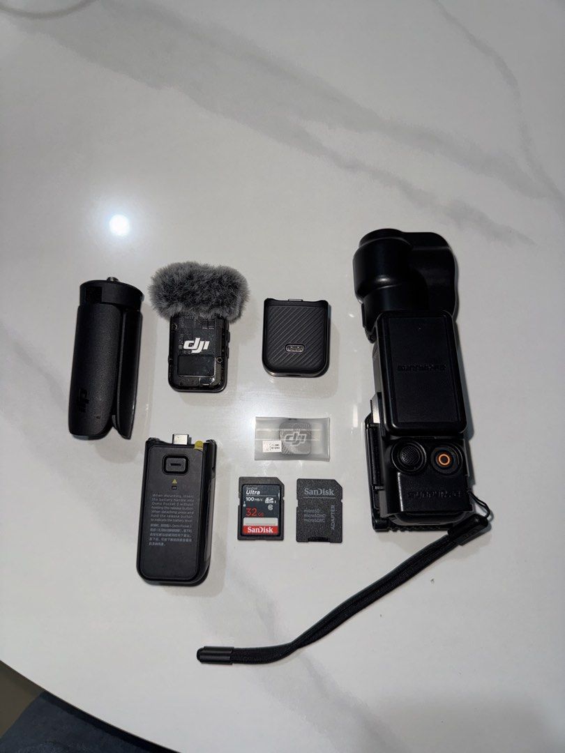 DJI Osmo Pocket 3 Creator Combo with Accessories (Category: Cameras) located in Cavite. Submitted by jayjaybarlaan (Listing ID 1458332100, Image 1). Description: - DJI Osmo Pocket 3 Creator Combo - Includes: Camera, Mic Transmitter, Mic Windscreen, Battery Handle, Mini Tripod, Carrying Bag - Bonus: 2x SanDisk 32GB Extreme SD Cards & DJI Memory Card Case - Ideal for vlogging and content creation.