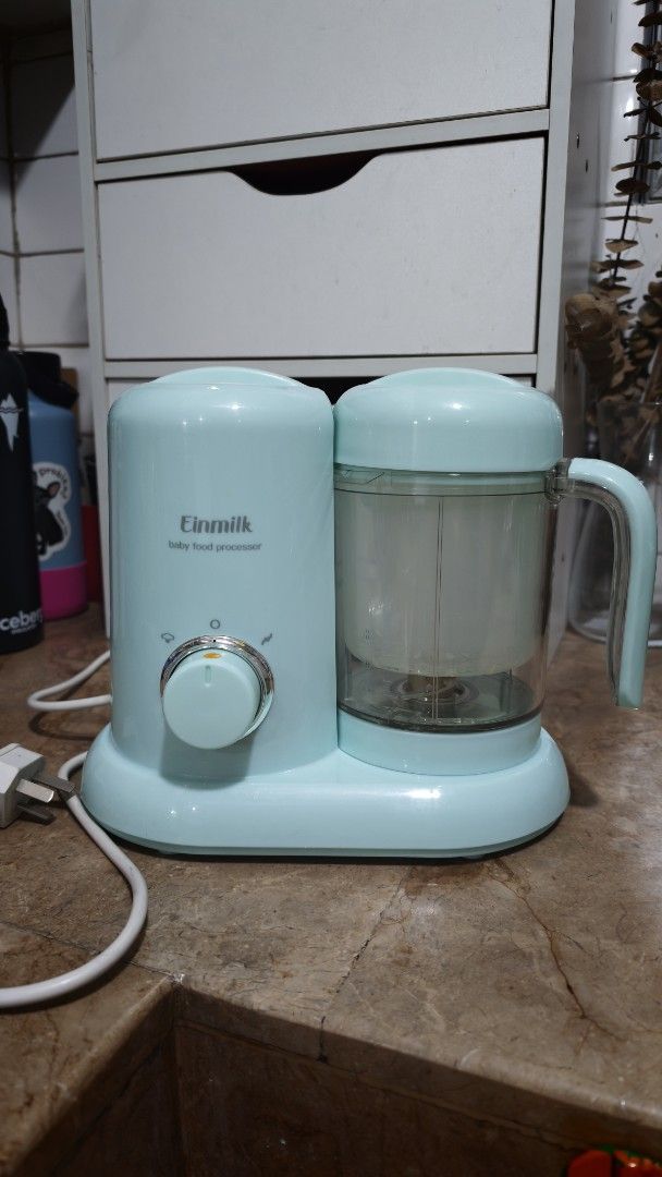 Einmilk Baby Food Processor Steamer and Blender (Category: Weaning & Toddler Feeding) located in Quezon City. Submitted by smai_k (Listing ID 1458445821, Image 1). Description: - Einmilk Baby Food Processor - Steams and blends food for your baby - Comes with measuring cups and spatula - Features an easy-to-use dial for settings - Perfect for making homemade baby food - Unit is clean and ready for its new home Like new Barely used No stains.