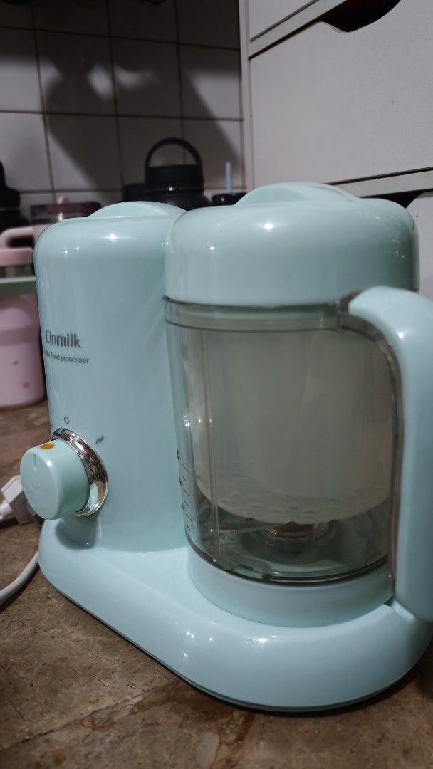 Einmilk Baby Food Processor Steamer and Blender (Category: Weaning & Toddler Feeding) located in Quezon City. Submitted by smai_k (Listing ID 1458445821, Image 3). Description: - Einmilk Baby Food Processor - Steams and blends food for your baby - Comes with measuring cups and spatula - Features an easy-to-use dial for settings - Perfect for making homemade baby food - Unit is clean and ready for its new home Like new Barely used No stains.