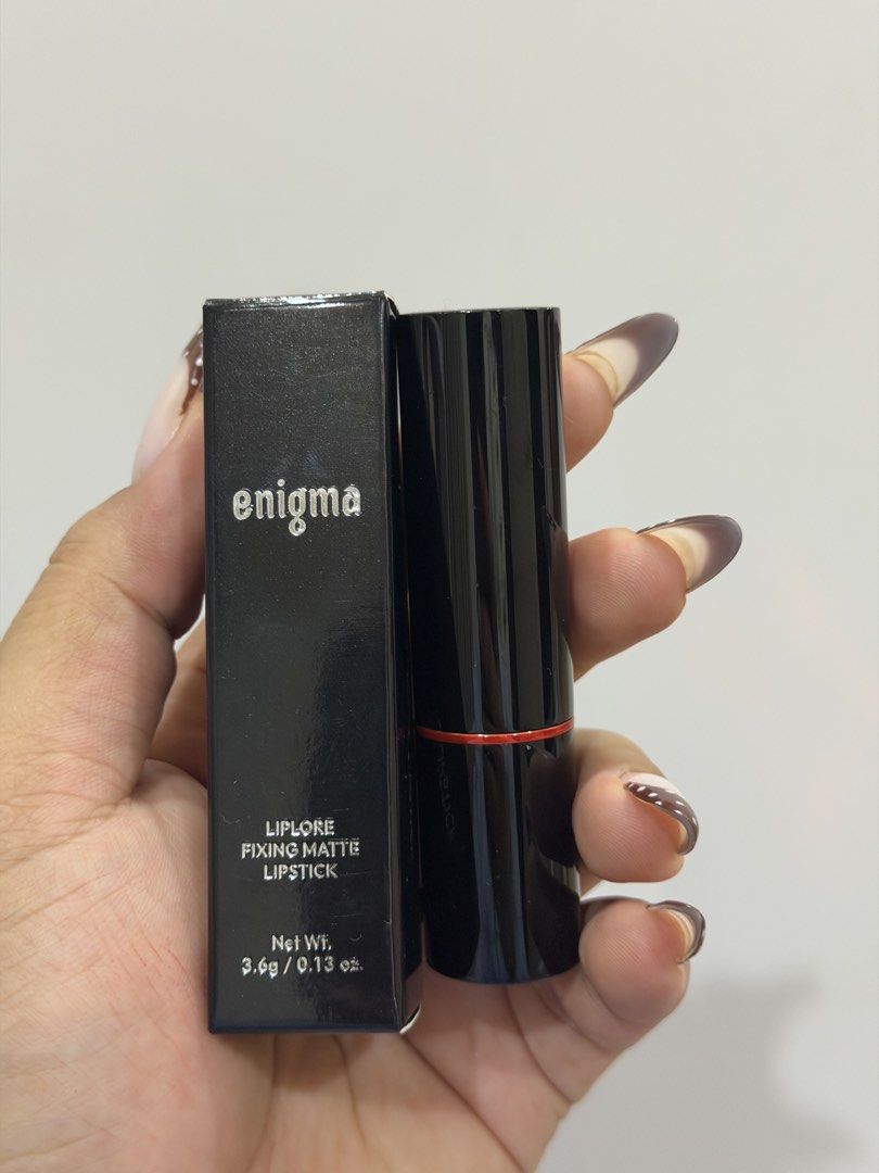 Enigma Liplore Fixing Matte Lipstick - Fuss (Category: Makeup) located in Manila. Submitted by declutterreset.ry (Listing ID 1458483993, Image 2). Description: - Enigma Liplore Fixing Matte Lipstick - Shade: Fuss (muted rose/brownish-pink) - Finish: Matte - Swatched 3x - Condition: Comes with original box - Perfect for: Everyday wear, subtle color.