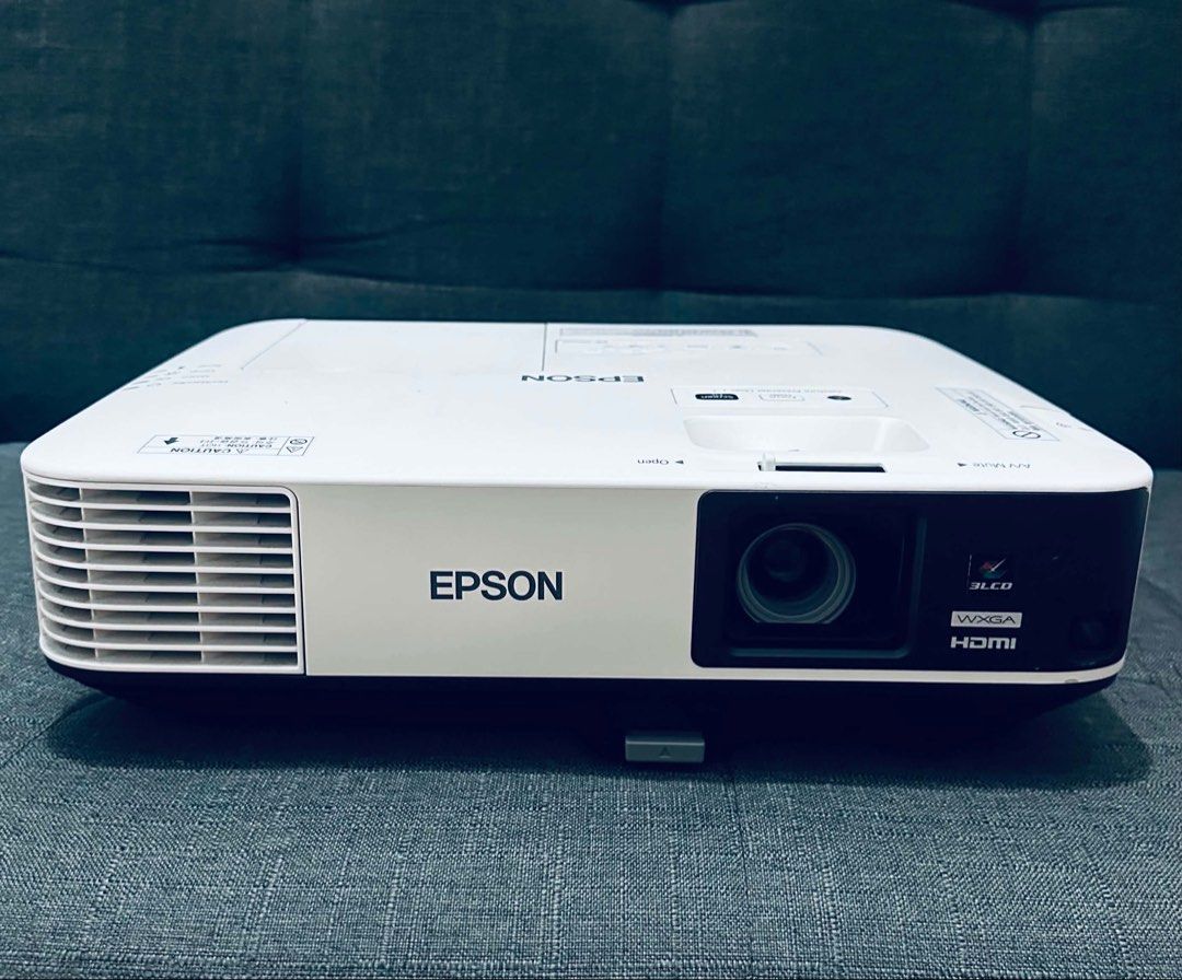 Epson EB-2155W WXGA HDMI Projector (Category: Projectors) located in Makati City. Submitted by BudgetProjectorManila (Listing ID 1458474341, Image 3). Description: - Epson EB-2155W Projector - WXGA Resolution - HDMI Input - Low Lamp Hours: 984 H - Connectivity: LAN, USB, RS-232C - Ideal for Presentations & Home Cinema - Selling As Is.