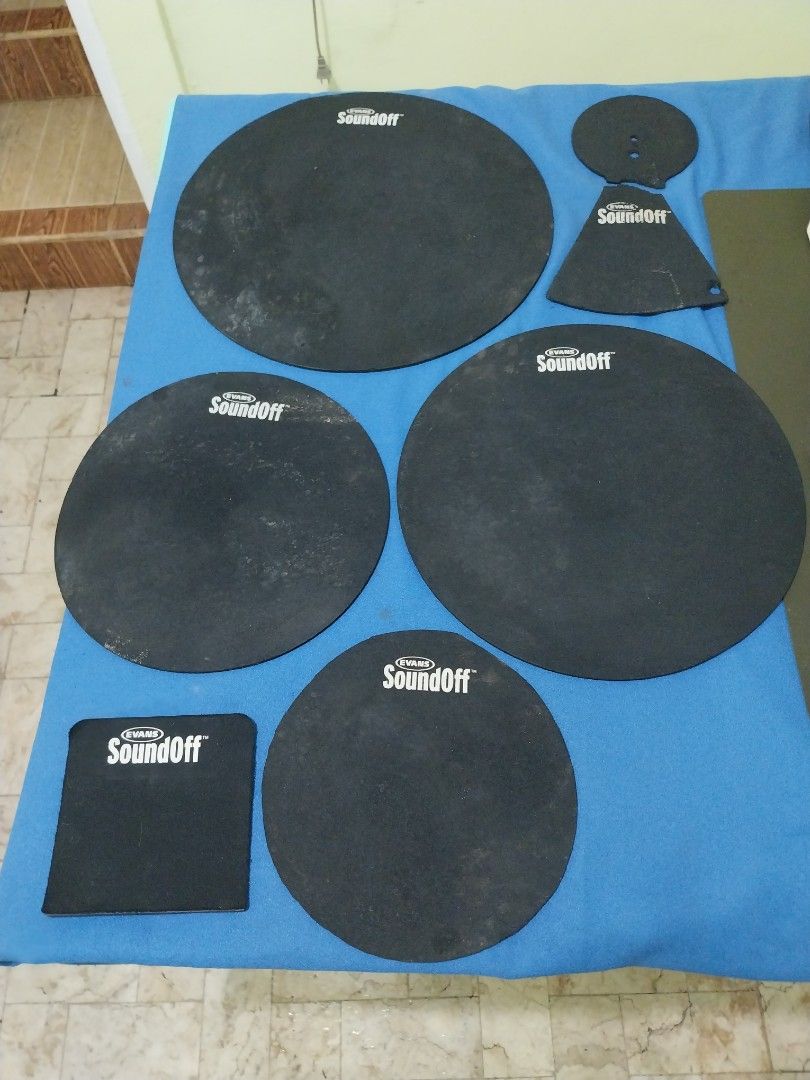 Evans SoundOff Drum Silencers (Category: Musical Instruments) located in Paranaque City. Submitted by MDC_rocks (Listing ID 1458387590, Image 1). Description: Evans SoundOff drum mutes. Set is incomplete. See pics attatched: - 10" - 12" - 14" - 16" - kick pad - cymbal mute (ripped) For standard drum kits. Practice anytime without disturbing anyone. Easy to install and remove. Dramatically reduces drum noise..