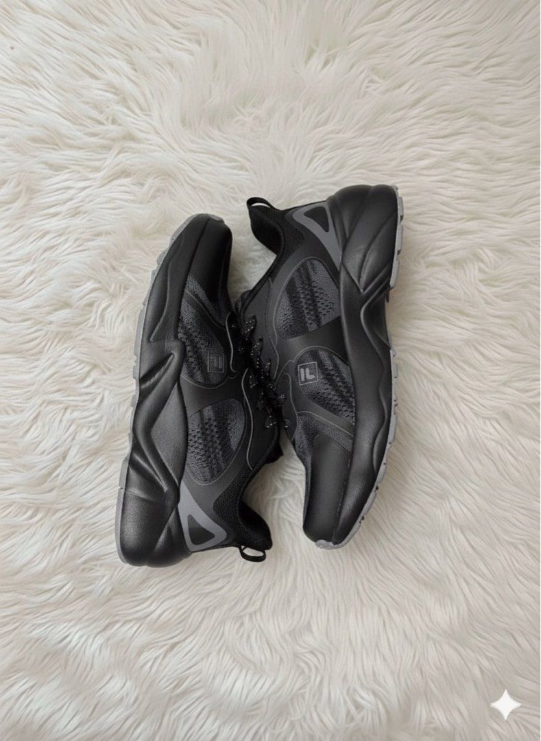 FILA Black Running Shoes (Category: Sneakers) located in Manila. Submitted by toastedsiopao.o (Listing ID 1458371828, Image 1). Description: - Black FILA running shoes - Lace-up style - Suitable for everyday wear or light jogs - Shows some signs of wear on mesh and soles - Plenty of life remaining - Sold as is.