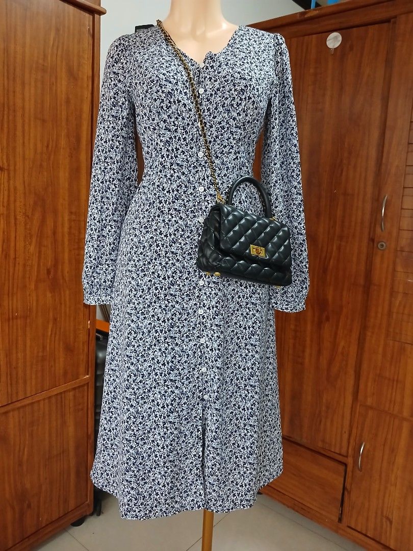 Floral Print Long Sleeve Button Down Midi Dress (Category: Dresses) located in Calamba. Submitted by BraidApparel (Listing ID 1458380521, Image 2). Description: - Navy and white floral print midi dress - Long sleeves with button cuffs - Button-down front - Midi length - Perfect for casual outings or dressier events - Easy to wear and style.