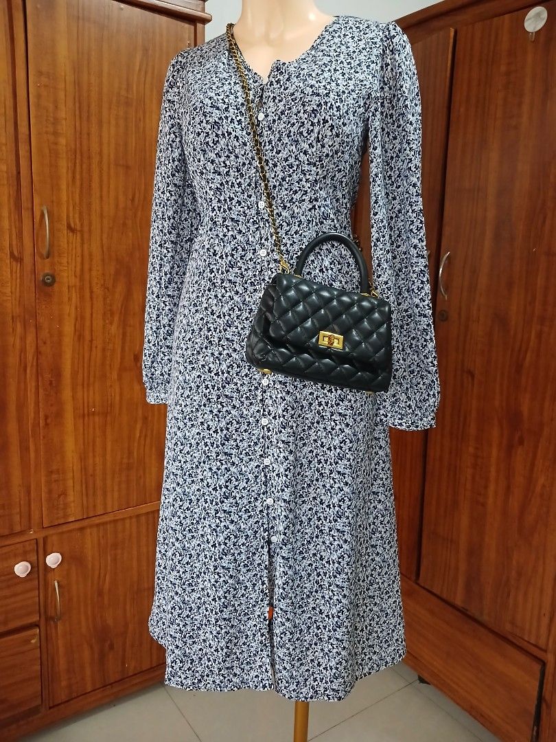 Floral Print Long Sleeve Button Down Midi Dress (Category: Dresses) located in Calamba. Submitted by BraidApparel (Listing ID 1458380521, Image 1). Description: - Navy and white floral print midi dress - Long sleeves with button cuffs - Button-down front - Midi length - Perfect for casual outings or dressier events - Easy to wear and style.