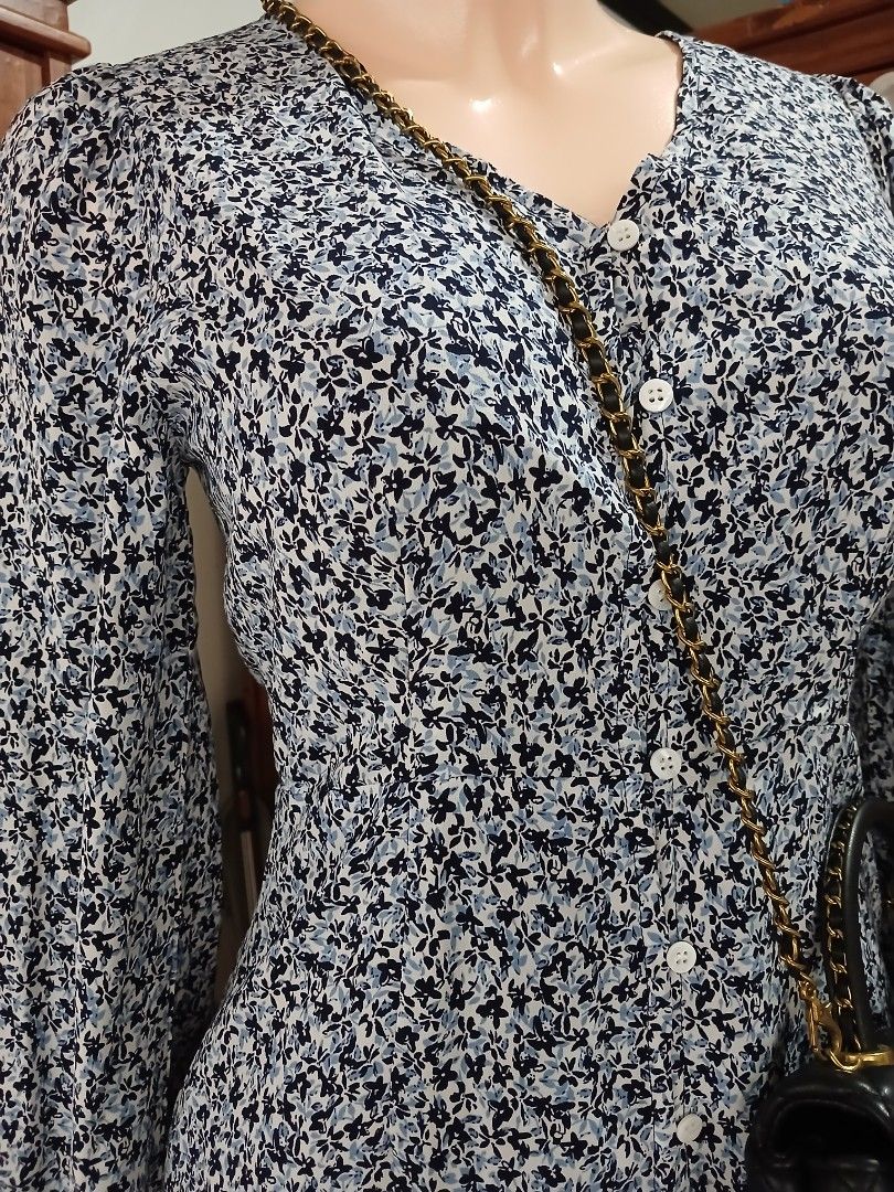 Floral Print Long Sleeve Button Down Midi Dress (Category: Dresses) located in Calamba. Submitted by BraidApparel (Listing ID 1458380521, Image 3). Description: - Navy and white floral print midi dress - Long sleeves with button cuffs - Button-down front - Midi length - Perfect for casual outings or dressier events - Easy to wear and style.