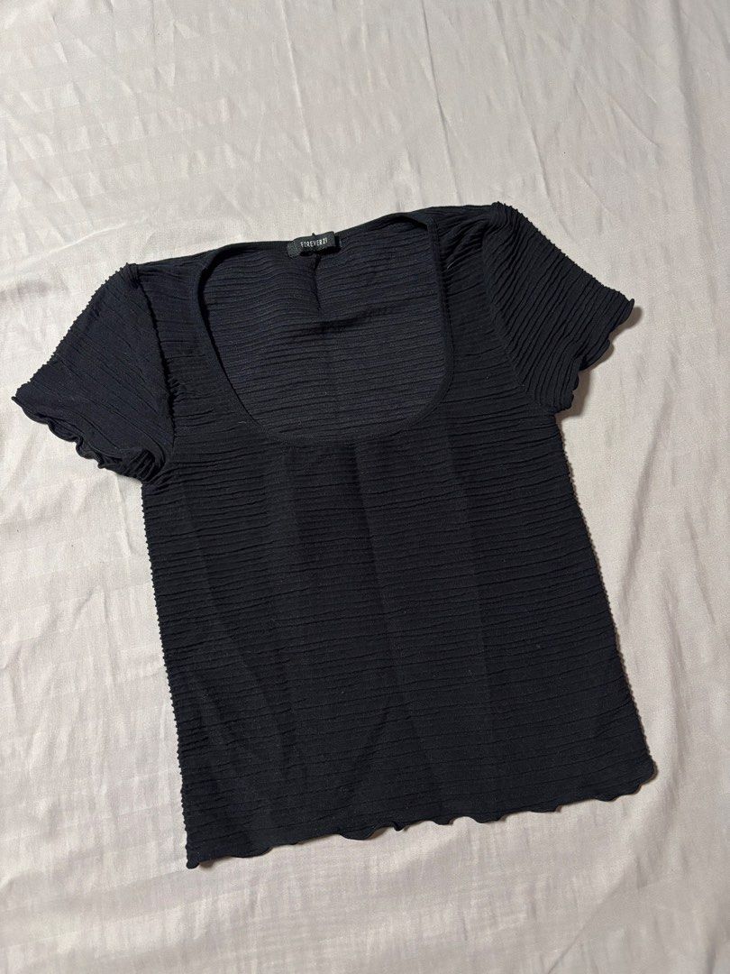 Forever 21 Black Textured Square Neck Top (Category: Sleeveless) located in Manila. Submitted by prelovedsam_ (Listing ID 1458347008, Image 2). Description: - Forever 21 black top - Textured fabric all over - Square neckline - Short sleeves with lettuce edge detail - Lettuce edge hem detail - Cropped fit - Easy to pair with any bottoms.