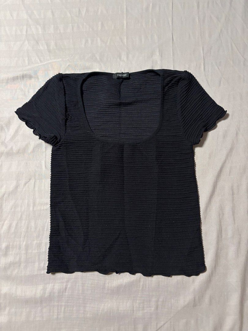 Forever 21 Black Textured Square Neck Top (Category: Sleeveless) located in Manila. Submitted by prelovedsam_ (Listing ID 1458347008, Image 1). Description: - Forever 21 black top - Textured fabric all over - Square neckline - Short sleeves with lettuce edge detail - Lettuce edge hem detail - Cropped fit - Easy to pair with any bottoms.