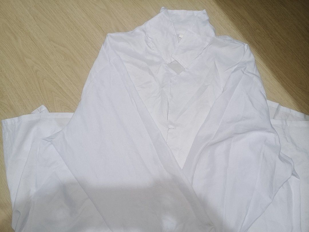 Garterized Lab Gown (L-XL) (Category: Blouses) located in Muntinlupa City. Submitted by jfkscjskckdkkcksoc (Listing ID 1458396574, Image 1). Description: - Laboratory Gown - Has visible stains in sleeves and pockets - Garterized sleevs - Features a high collar and wrap-around style - Lightweight material - Ideal for cultural events or performances.