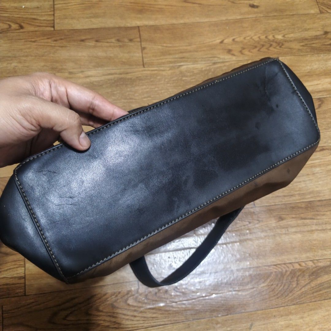 Girbaud Shoulder Bag Brown Black Leather Nylon (Category: Shoulder Bags) located in Manila. Submitted by narju1234 (Listing ID 1458379083, Image 2). Description: - Girbaud shoulder bag - Material: Brown nylon and black leather - Features: Zippered main compartment, exterior zippered pocket with flap - Strap: Adjustable - Condition: Some signs of wear on leather (especially base), otherwise functional and stylish..