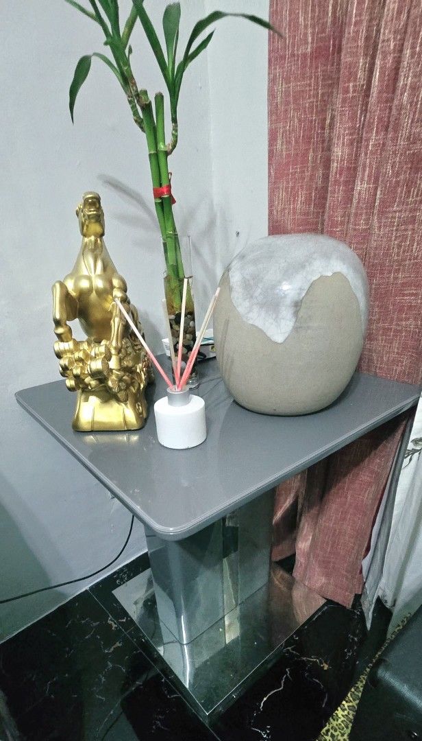 Gold Horse Figurine, Reed Diffuser, Lucky Bamboo, Stone Decor (Category: Other Home Decor) located in Manila. Submitted by ubasirene (Listing ID 1458409204, Image 2). Description: Center / Side table 40x40x60 tempared glass gray with combi chrome. Bought for 10K thus selling low for 5K only. Rfs redesign my living room. magpalit ako. Iam also selling the set of recliner leather sofa 2&1seater with minor/need repair due to wear and tear if masilil