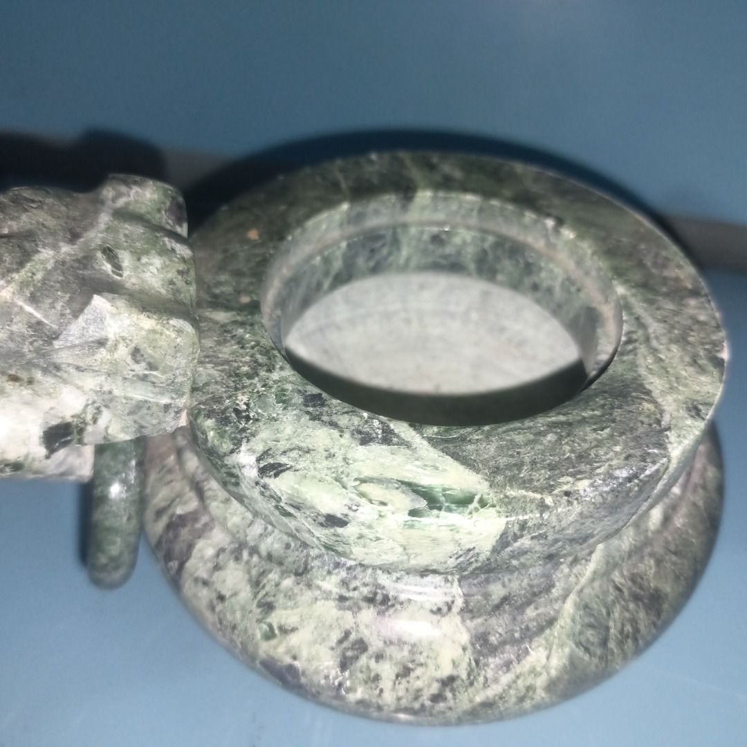 Green Marble Incense burner (Category: Pots & Planters) located in Munoz. Submitted by larryc1212 (Listing ID 1458436430, Image 3). Description: - Elegant green marble incense burner with beautiful veined patterns. - Features a convenient handle on one side. - Stands sturdily on three decorative legs. - Ideal for displaying as a decorative accent or housing small plants. - Compact size: approximately 4 inches in height. - With Issue Disclaimer: I