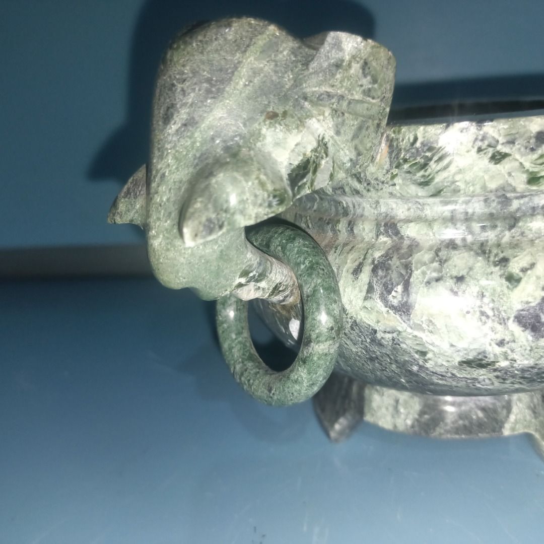 Green Marble Incense burner (Category: Pots & Planters) located in Munoz. Submitted by larryc1212 (Listing ID 1458436430, Image 2). Description: - Elegant green marble incense burner with beautiful veined patterns. - Features a convenient handle on one side. - Stands sturdily on three decorative legs. - Ideal for displaying as a decorative accent or housing small plants. - Compact size: approximately 4 inches in height. - With Issue Disclaimer: I
