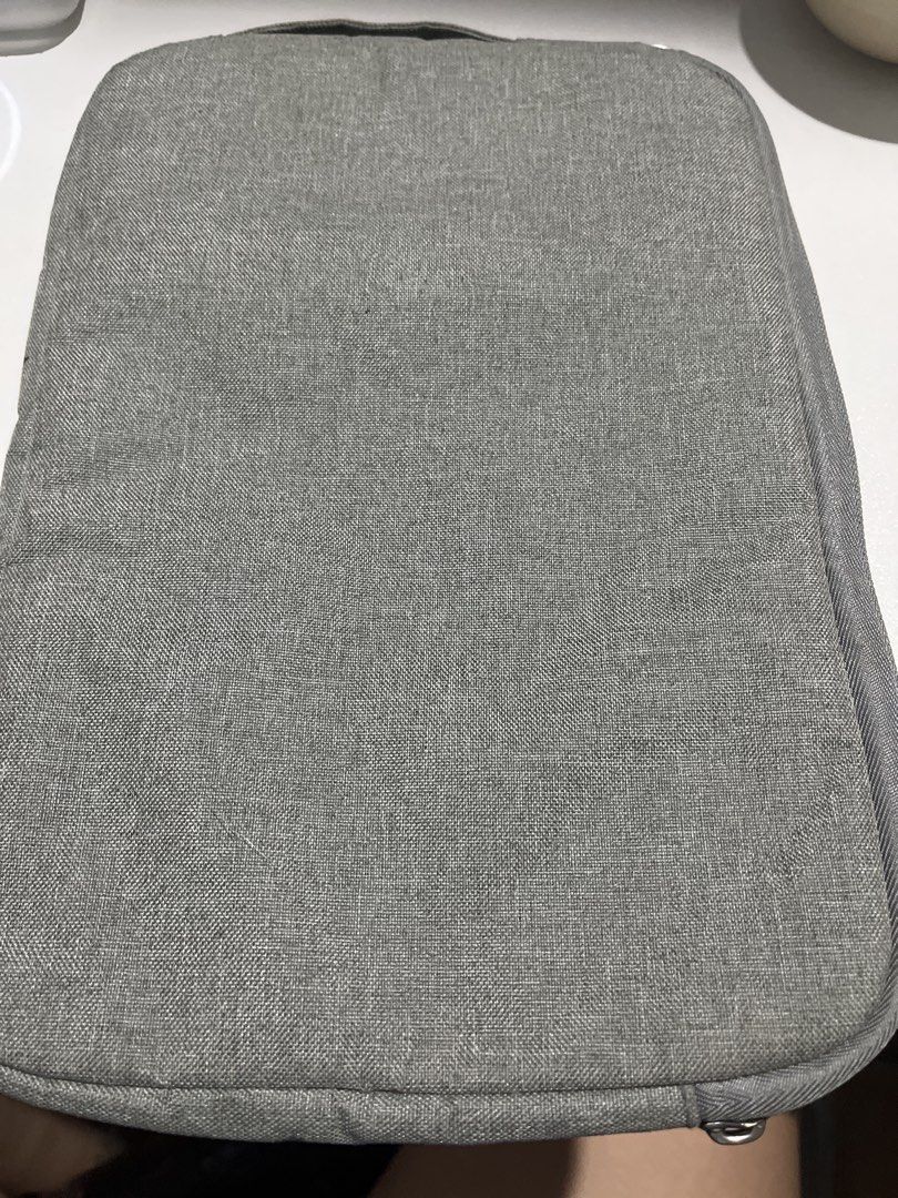 Grey Padded Tablet Sleeve Case 11inch (Category: Laptop Bags & Sleeves) located in Manila. Submitted by camron08 (Listing ID 1458360736, Image 1). Description: - Grey laptop sleeve - Padded for extra protection - Secure zipper closure - Fits most standard laptops - Simple and functional design for safe carrying.