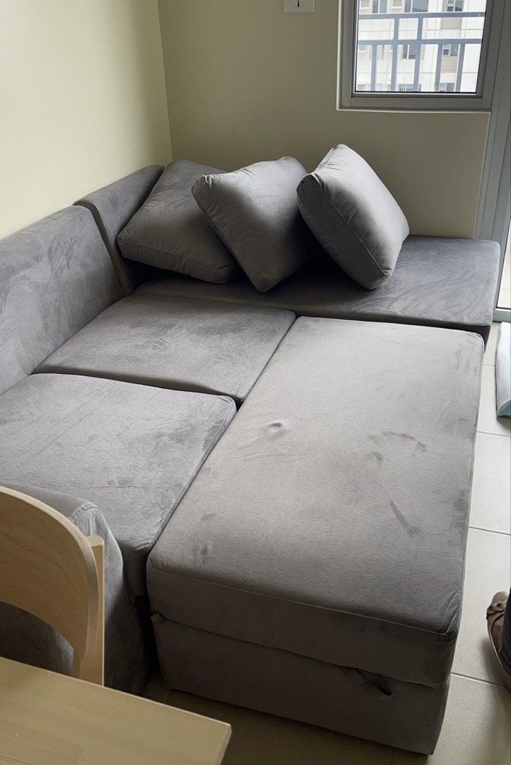 Grey Sectional Sofa with Chaise (Category: Sofas) located in Quezon City. Submitted by jhohau (Listing ID 1458310953, Image 2). Description: - Comfortable and spacious grey sectional sofa - Ideal for living rooms - Includes multiple cushions - Easy to arrange in various configurations - Soft fabric, great for lounging and entertaining - Fits well in most spaces - Has a slight dent on the left side part - Well maintained and used, no scratches on 