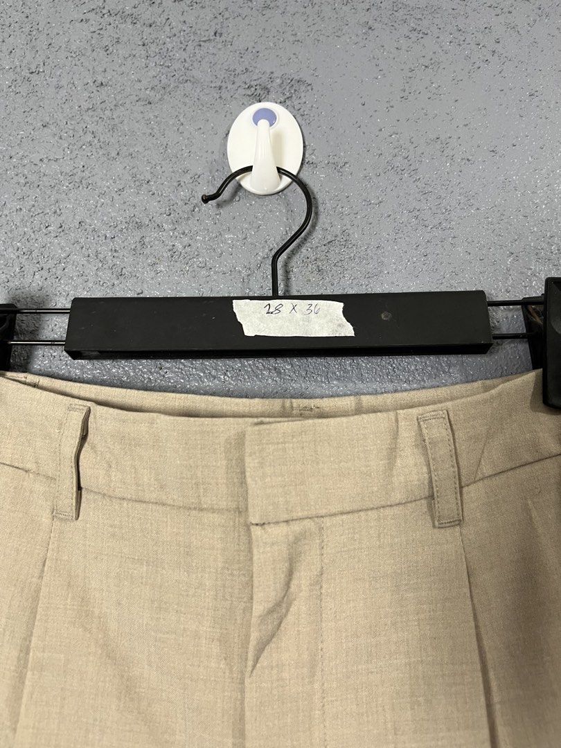 GU Beige Pleated Trousers Size S (Category: Other Bottoms) located in Famy. Submitted by basicthrifted (Listing ID 1458443784, Image 3). Description: - Brand: GU - Color: Beige - Size: S - Fit: Relaxed - Style: Classic, pleated - Material: Polyester, Rayon, Polyurethane blend (check tag for exact composition) - Versatile: Easy to pair with various tops for casual or smart-casual outfits.