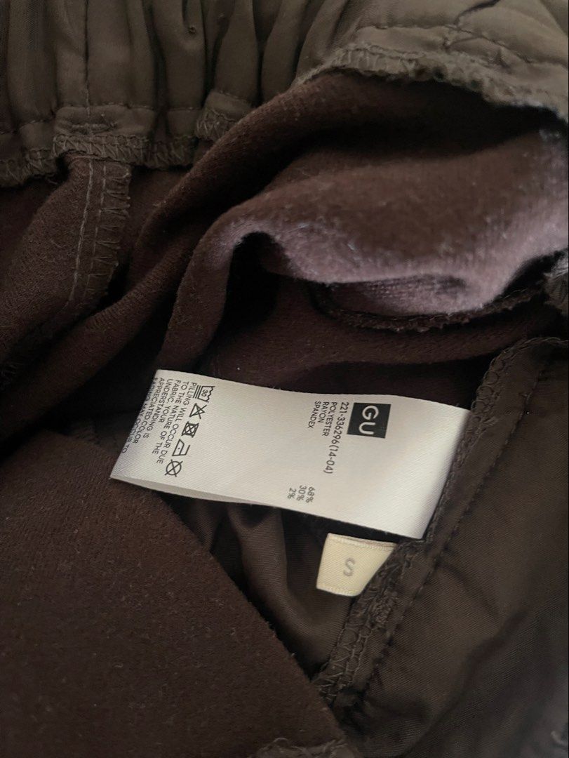 GU Chocolate Brown Pants (Category: Other Bottoms) located in Quezon City. Submitted by booktt (Listing ID 1458396861, Image 2). Description: chocolate brown small tapered pants.