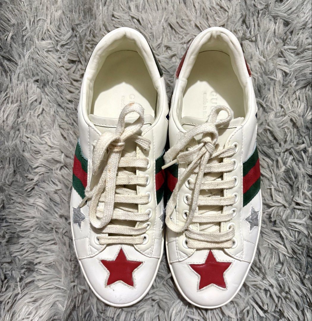 Gucci Ace Star (Category: Sneakers & Footwear) located in Manila. Submitted by jlj_v.2_oshop (Listing ID 1458317861, Image 1). Description: Gucci Ace Star sneakers in white leather, featuring the brand’s signature red and green web stripe and embroidered star details. I bought these collections of bags and shoes from a seller friend who sources boxes from Japan, Korea, and Thailand. These are preloved and well-loved items. Authenticity is not gua