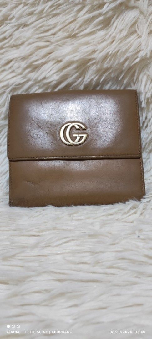 🇯🇵Gucci Marmont bifold wallet (Category: Luxury Bags & Wallets) located in Makati City. Submitted by yerbua103 (Listing ID 1458478889, Image 1). Description: A beautiful compact vintage wallet from Gucci in camel/dark beige leather bifold wallet featuring the iconic interlocking gold-tone logo. It is chic, minimalist and functional. Manage your expectations as you're buying a preloved/ukay wallet. I don't authenticate as I'm not an expert nor a