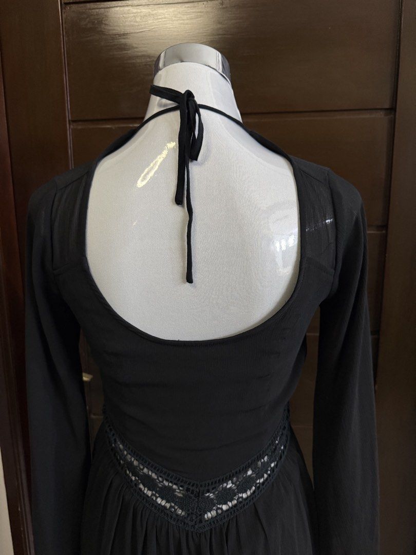 Hollister Evening dress (Category: Dresses) located in Quezon City. Submitted by soloqueenph (Listing ID 1458358444, Image 3). Description: Chic black mini dress with sheer long sleeves, deep V-neck, and lace waist detail. Features a tie-neck back and A-line skirt. Perfect for nights out or special events. Small to medium .