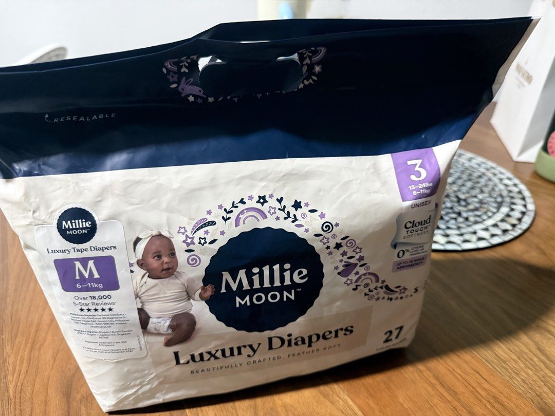 Hoppi Luxury Tape Diapers Size S (Category: Diapers & Baby Wipes) located in Mandaluyong City. Submitted by lulubelle86 (Listing ID 1458425414, Image 1). Description: - Hoppi Tape Diapers - Size: S - Weight Range: 0-5kg - Features: Cloud touch softness, up to 12 hours absorbency - Quantity: 23 diapers Millie Moon bag only. Hoppi diapers inside. Rfs: too small for baby.