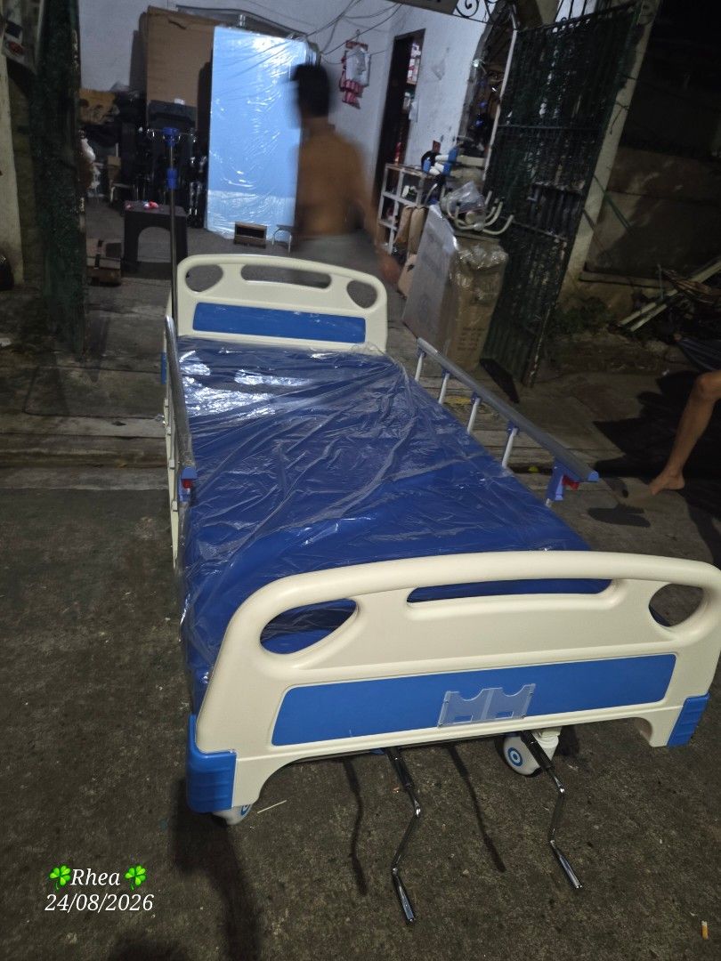 Hospital Bed with Wheels and Adjustable Features (Category: Medical Supplies & Tools) located in Manila. Submitted by reynard566 (Listing ID 1458463578, Image 2). Description: - Hospital bed with wheels for easy mobility - Adjustable head and foot sections - Sturdy and functional design - Blue and white color scheme - Ready for a new home.