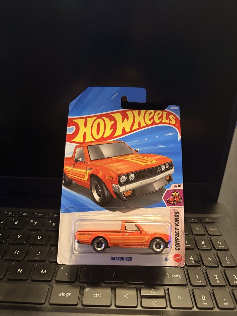 Hot Wheels Datsun 620 Compact Kings Orange (Category: Vehicle & Diecast Models) located in Manila. Submitted by truewind.014552 (Listing ID 1458432949, Image 1). Description: - Hot Wheels Orange Datsun 620 Pickup Truck - Part of the Compact Kings Series (6/10) .