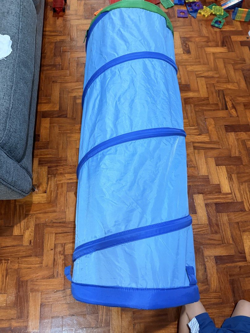 IKEA Blue Children's Play Tunnel (Category: Infant Playtime) located in Quezon City. Submitted by eimaj08 (Listing ID 1458350346, Image 2). Description: - Blue play tunnel for kids - Folds flat for convenient storage - Perfect for indoor and outdoor fun - Simple to set up and take down - Ideal for crawling and imaginative play.