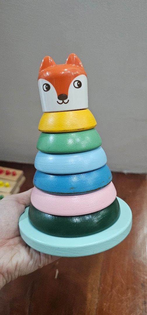 Ikea Wooden Fox Stacking Rings Toy (Category: Educational & Learning Toys) located in Manila. Submitted by sheshe08 (Listing ID 1458426100, Image 1). Description: - Adorable wooden fox stacking toy - Includes colorful rings: yellow, green, blue, pink, dark green - Light blue base - Perfect for developing stacking skills - Encourages color recognition - Minor signs of wear on rings, but fully functional and fun.