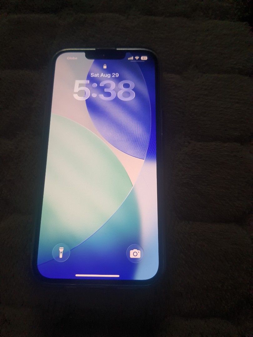 IPHONE 13 (Category: iPhone 13 Series) located in Quezon City. Submitted by shebesande (Listing ID 1458398623, Image 2). Description: - iPhone 13 - Color: Sierra Blue - Storage: 128GB - Condition: Good, with minor signs of wear - Battery Health: 64% (may require replacement soon) - Meetup location: Quezon City.
