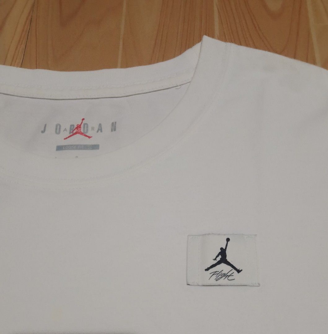 Jordan essential boxy tee2 (Category: Shirts) located in San Jose del Monte. Submitted by azetor (Listing ID 1458316462, Image 2). Description: - White Jordan T-Shirt - essential boxy tee2 - Fit: Loose fit crop top - Material: 100% Cotton - Features: Jumpman logo and 'Flight' graphic patch on chest - Ideal for: Casual wear - measurements - chest 20 - length 20 - excellent condition .