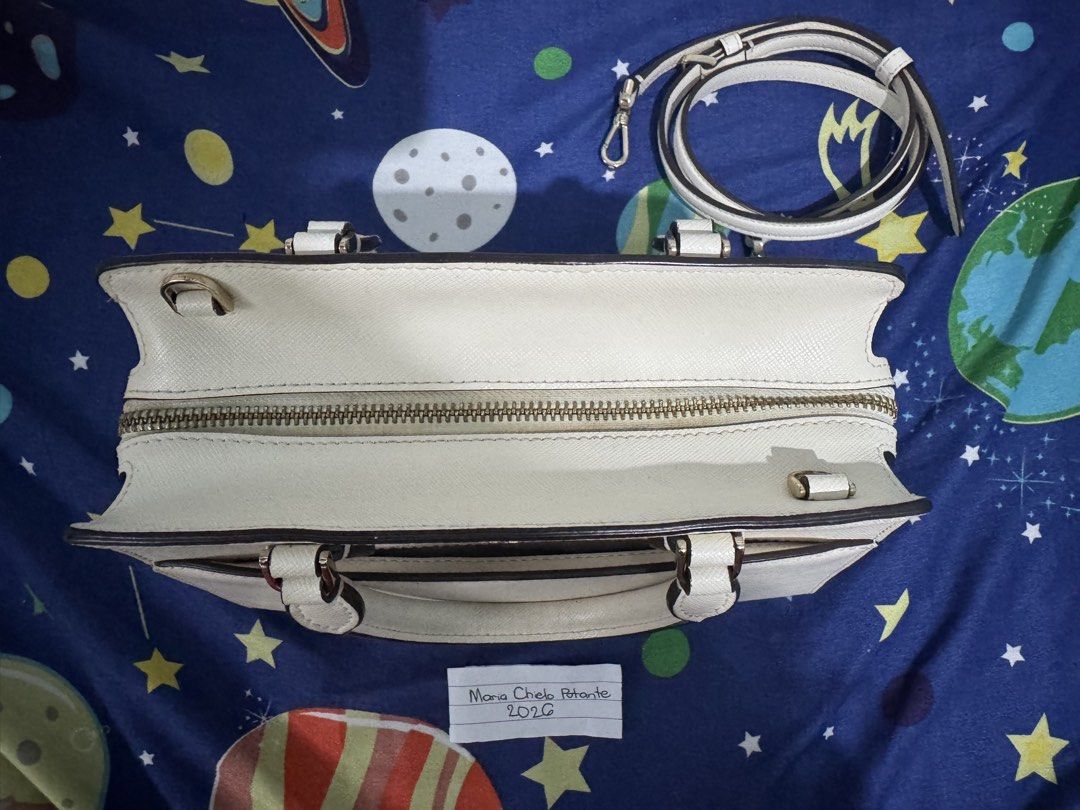 Kate Spade Madison Small Satchel Bag (Category: Luxury Bags & Wallets) located in Tanza. Submitted by chi_0826 (Listing ID 1458362762, Image 3). Description: 3,200 + SF Authentic Kate Spade NY cream saffiano leather satchel and crossbody bag - Champagne gold hardwares - Versatile with top handle and detachable crossbody strap - Convenient front pocket for quick access - Secure zipper closure - Clean and spacious interior - Ideal for both daily er