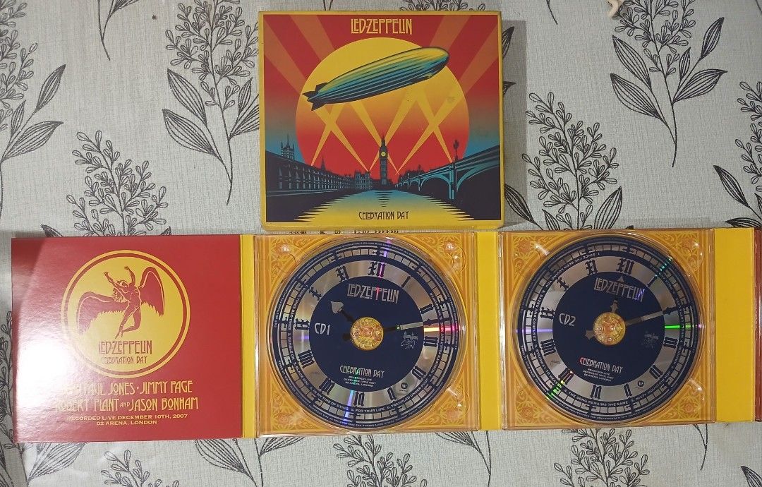 Led Zeppelin Celebration Day CD DVD Set (Category: CDs & DVDs) located in Manila. Submitted by miczngrz (Listing ID 1458437960, Image 3). Description: - Led Zeppelin Celebration Day live concert recording - Includes 2 CDs and 1 DVD - Recorded live on December 10th, 2007 at the O2 Arena, London - Features the full concert setlist - Comes in a slipcase with booklet - A must-have for any Led Zeppelin fan Tracklist: CD1-1 Good Times Bad Times 3:10 CD