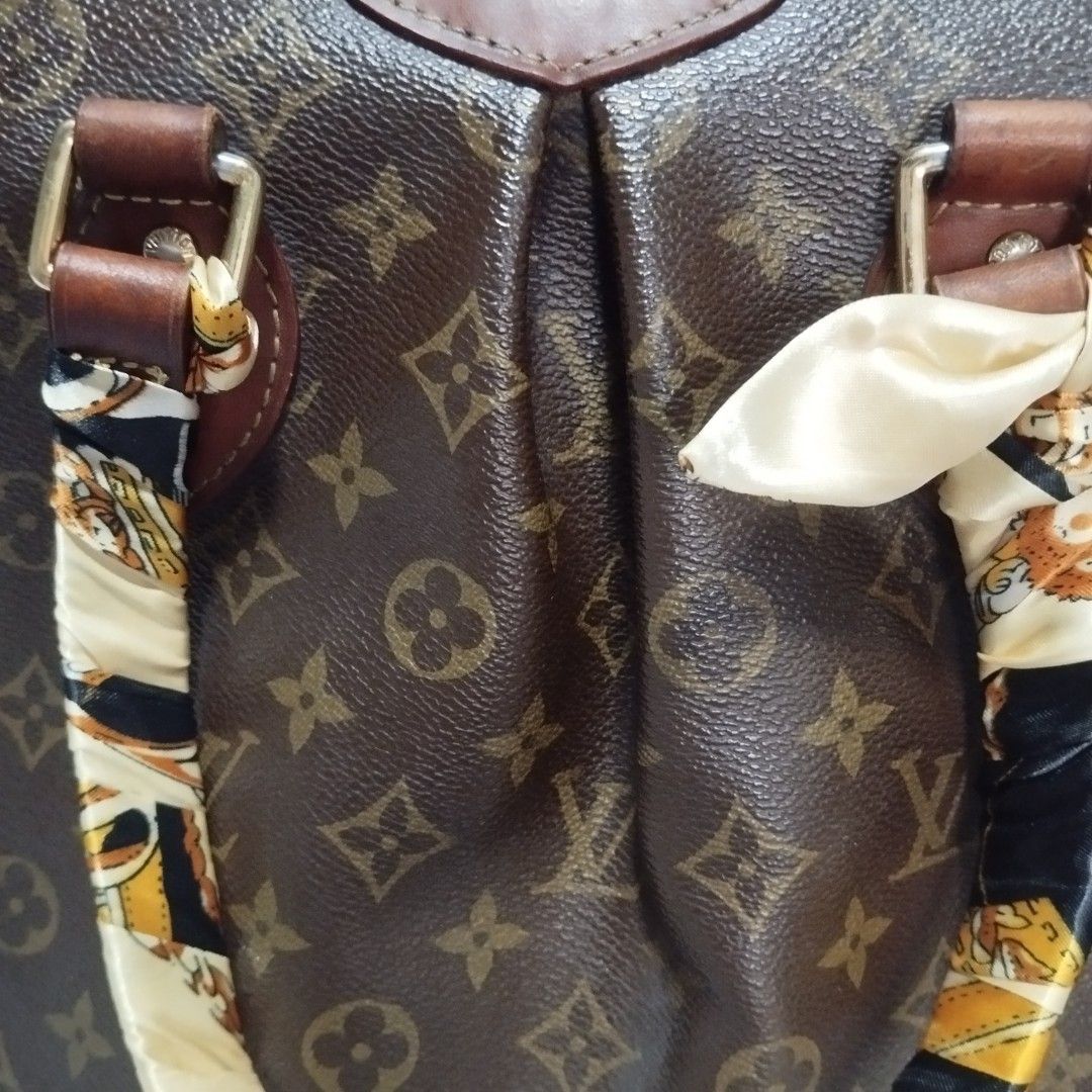Louis Vuitton Monogram Canvas Tote Bag (Category: Luxury Bags & Wallets) located in Manila. Submitted by lene48 (Listing ID 1458422511, Image 3). Description: - Classic Louis Vuitton monogram tote - Durable leather trim - Secure zipper closure - Interior pockets for organization - Comes with a stylish scarf tied to the handle - Ideal for everyday use - Spacious interior.